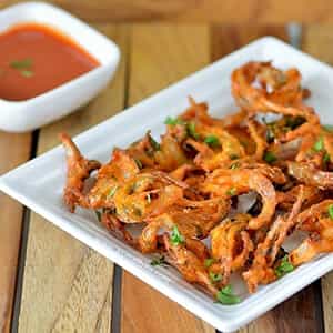 Onion Pakoda, Crispy onion fritters battered with flour and Indian spices
