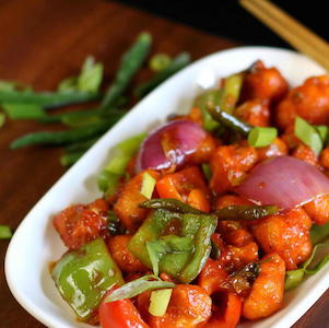 Gobi 65,Fried crispy cauliflower florets tossed in spicy Indian curry sauce